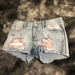 Blue and pink ripped shorts
